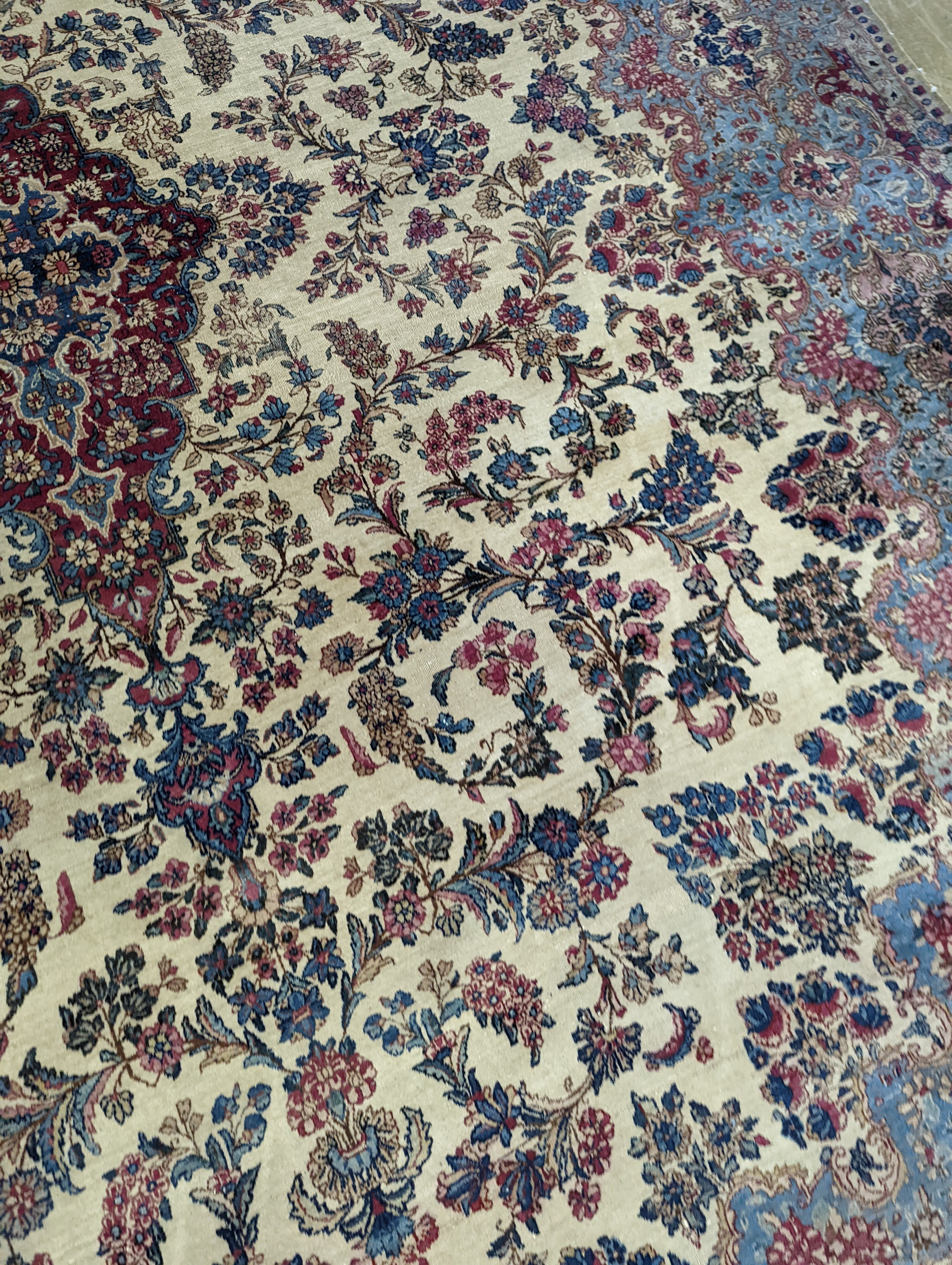 A North West Persian ivory ground carpet, 396 x 290cm